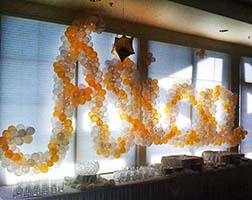 Wall sign of glod and clear swirled balloons for Alice's Bat Mitzvah