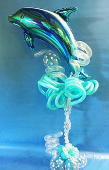 This mylar balloon dolphin centerpiece is created for a childrens event.