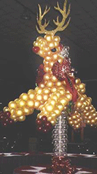 This five foot tall reindeer balloon sculpture serves as a eye catching buffet table decoration