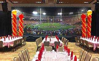 Red and gold balloon column decorations for a 49'ers football theme party