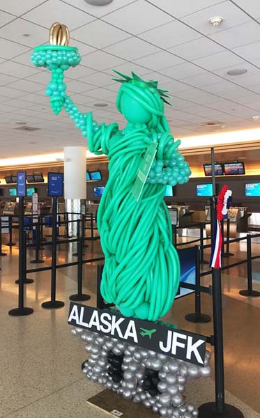 This 8 foot tall balloon sculptures of the  Statue of Libety was created for a San Jose California airport new fligt promotion