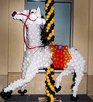 A white balloon sculpture of a carousel horse