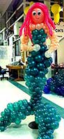 Balloon sculpture of a giant mermaid created for a commercial booth at a trade fair