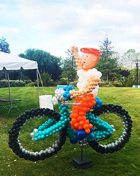 A giant six foot tall balloon sculpture bicycle promoting Bike-to-Work day