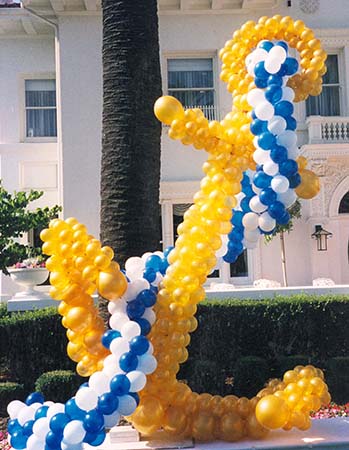 This five foot tall balloon sculpture anchor is constructed from gold balloons and is topped by a line made from blue and white balloons.