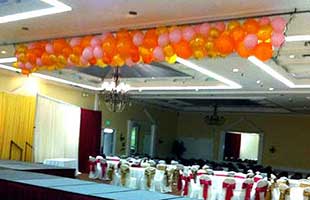 Net Style Drop of Orange and Gold Balloons
