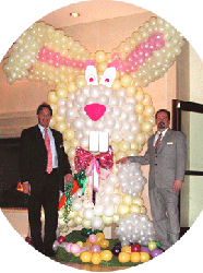 Eight foot tall balloon sculpture easter rabbit is the focal decoration at an Easter Brunch held at the Double Tree Hotel