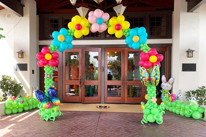 Easter theme arch decorating the entrance to a building