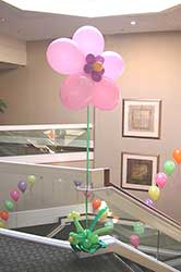 A pearl pink floating fantasy flower placed as a hall decoration.