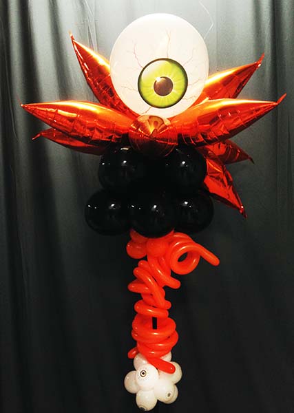A scary seven foot tall orange and black column topped by a giant staring blood-shot eyeball