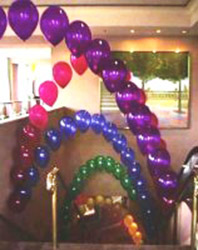 these arches of jewel tone balloons were placed above the escalator to provide a color filled guiide to New Year events.