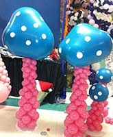 Balloon magical mushrooms add decor to Alice in Wonderland parties