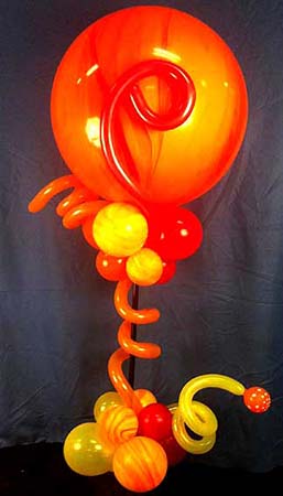 This orange and yellow balloon centerpiece gives a surreal hiot modern look to this event.