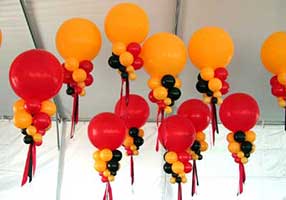Giant orange and red bubble decorations for corporate event held in a tent</span>