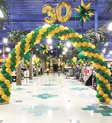 Swirled arch at store entrance for 30th anniversary sale event