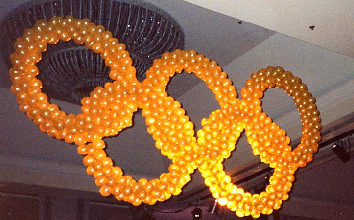 Olympic style rings with lined with lights used in a focal decoration for the conclusion of a corporate olympic competition