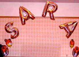 Name sign arch with mylar letter balloons
