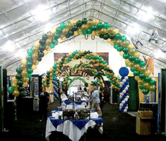 Balloon arches frame food tables at marketing event