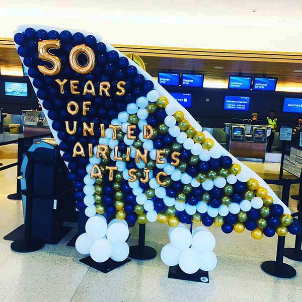 An aircraft vertical stabilizer balloon prop sculpture celebrating Ubnited Airlines 50 years of service at the San Jose International Airpor