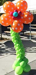 A free standing orange balloon fantaxy flower