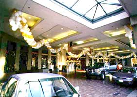 This 100 foot long swirled garland of gold, white and silver balloons framed the entrance to the San Jose Fairmont Hotel New Year's events.