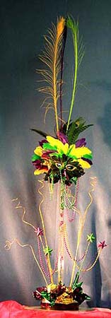 Carnival style centerpiece created with ting ting and feathers